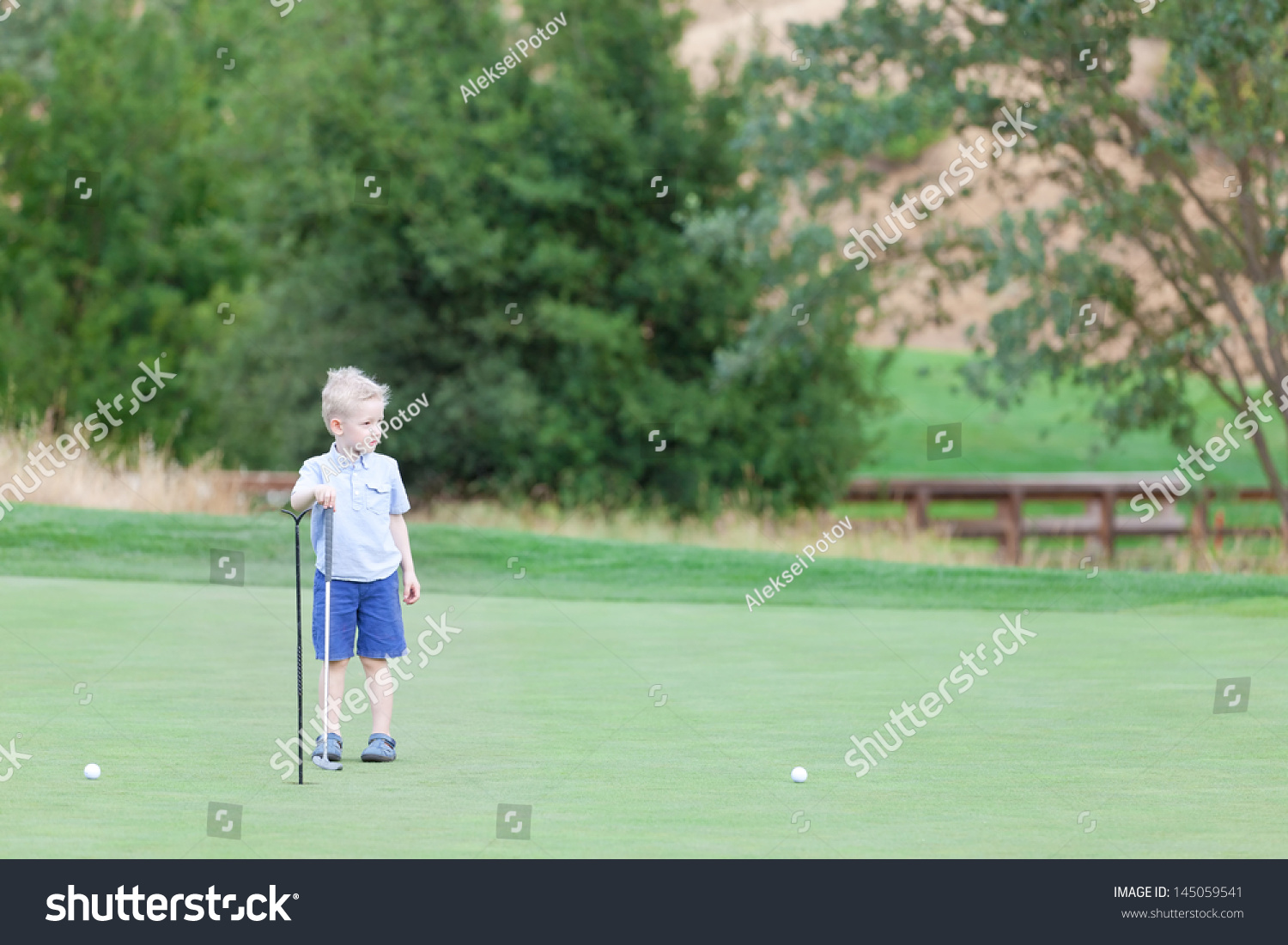 cute little boy at the golf course