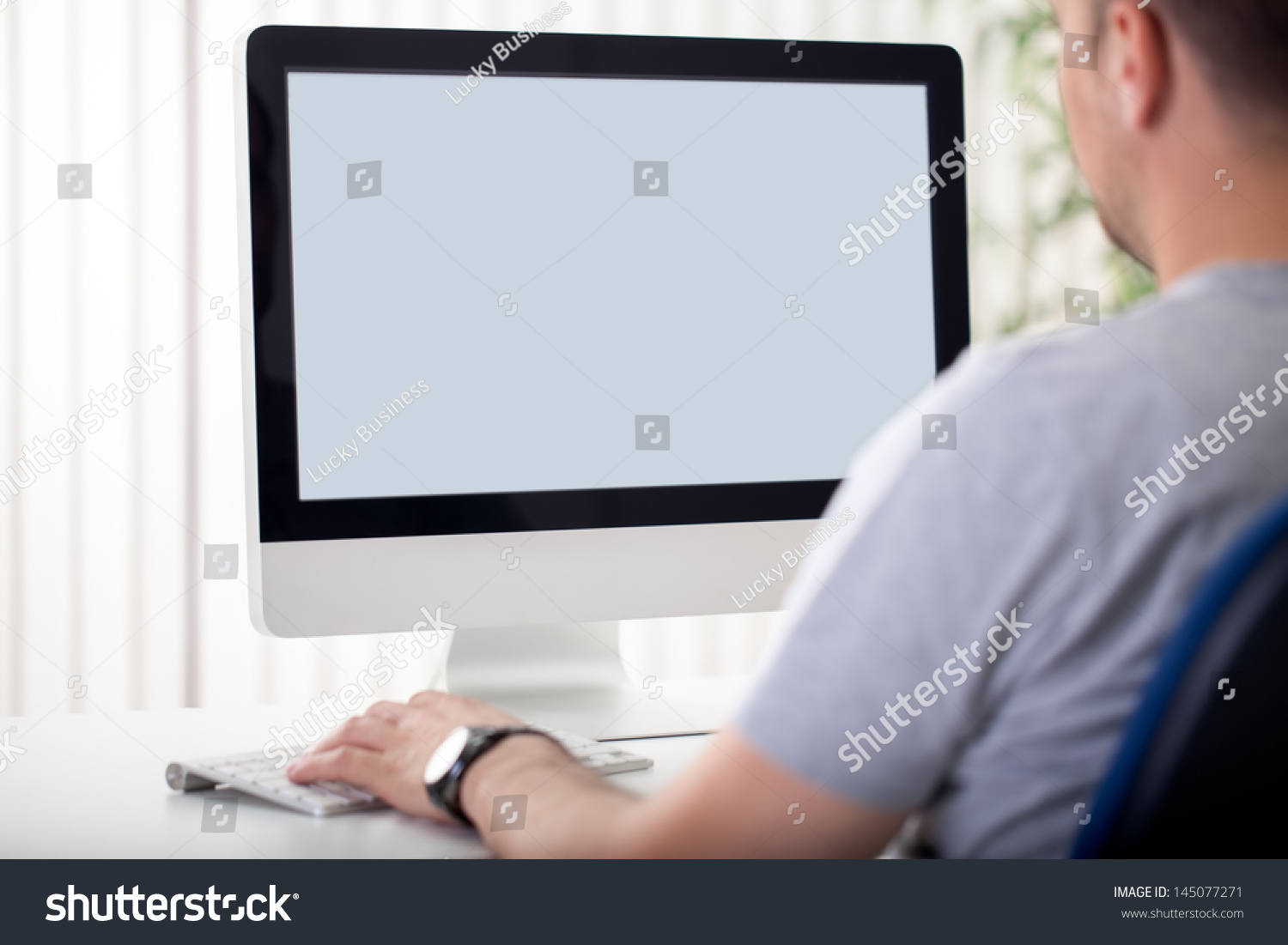 Man in front of computer screen