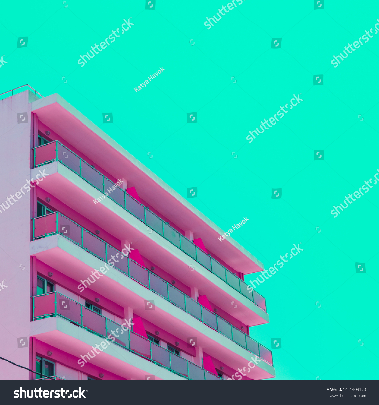 Pink hotel and green sky in infrared style. Tropical travel concept. Minimalism