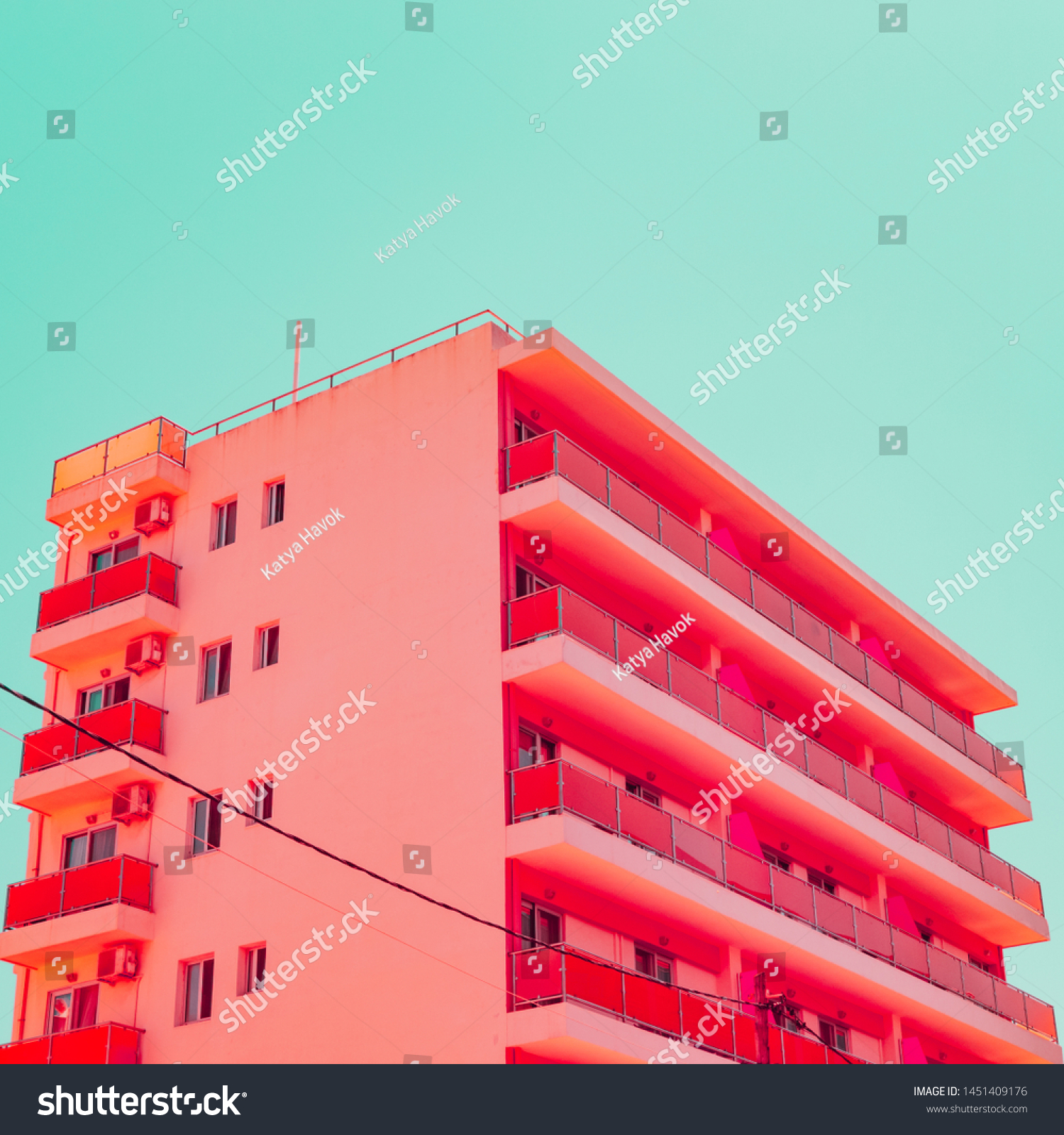 Orange hotel and blue sky in tropical travel concept. Minimalism