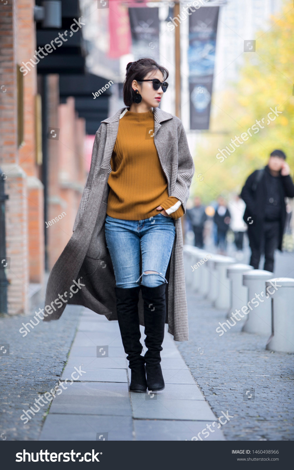 Asian fashion girl in trench coat on the street