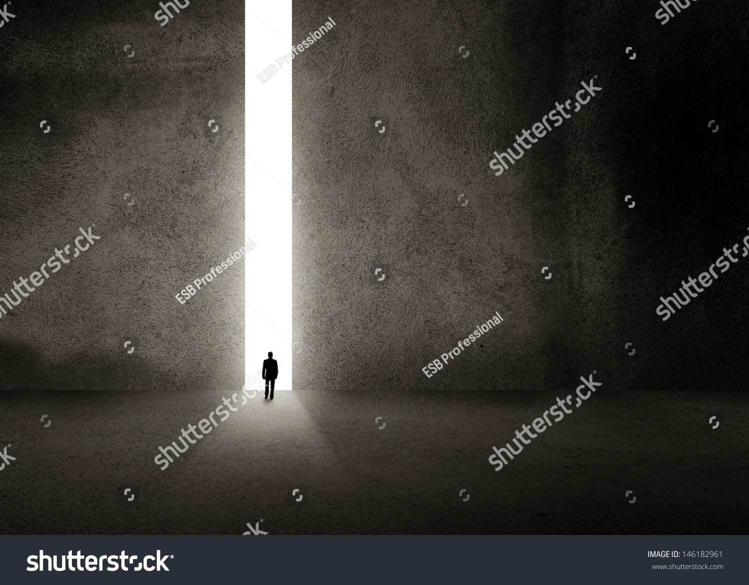 Silhouette of businessman entering giant doorway