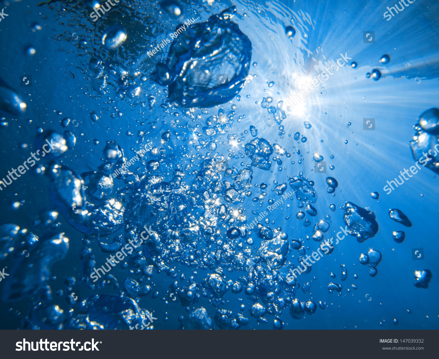 Air bubbles and sun rays underwater