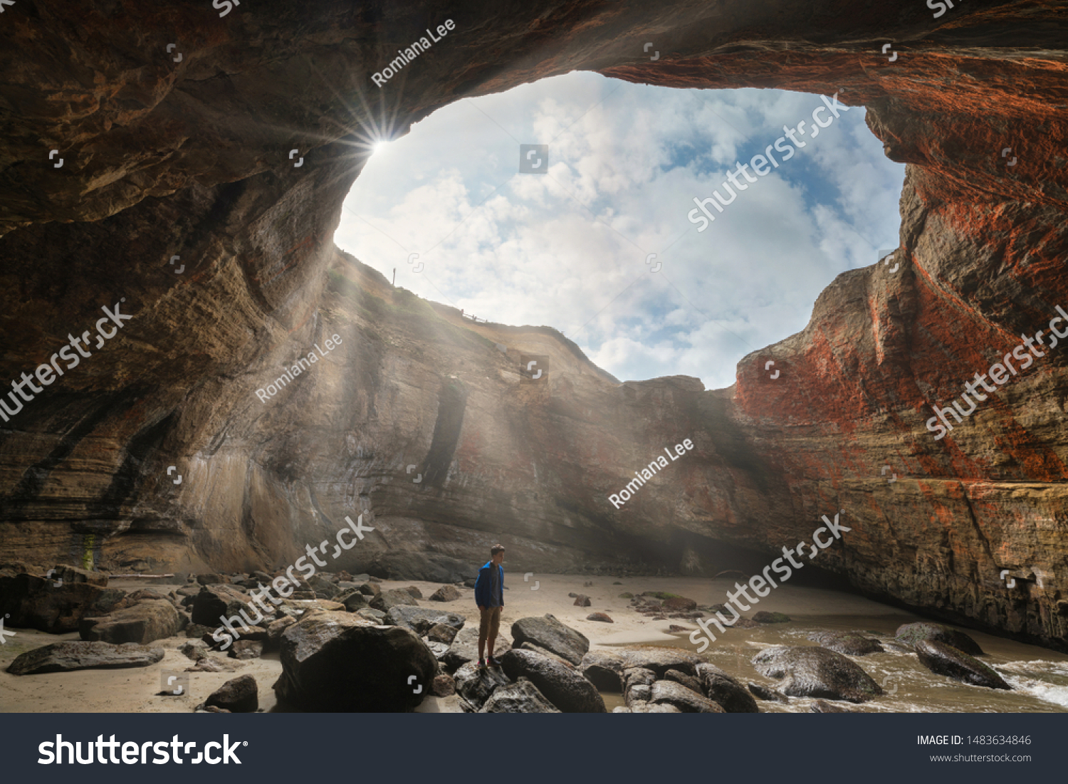 Devil's Punch bowl at low tide and a person exploring it