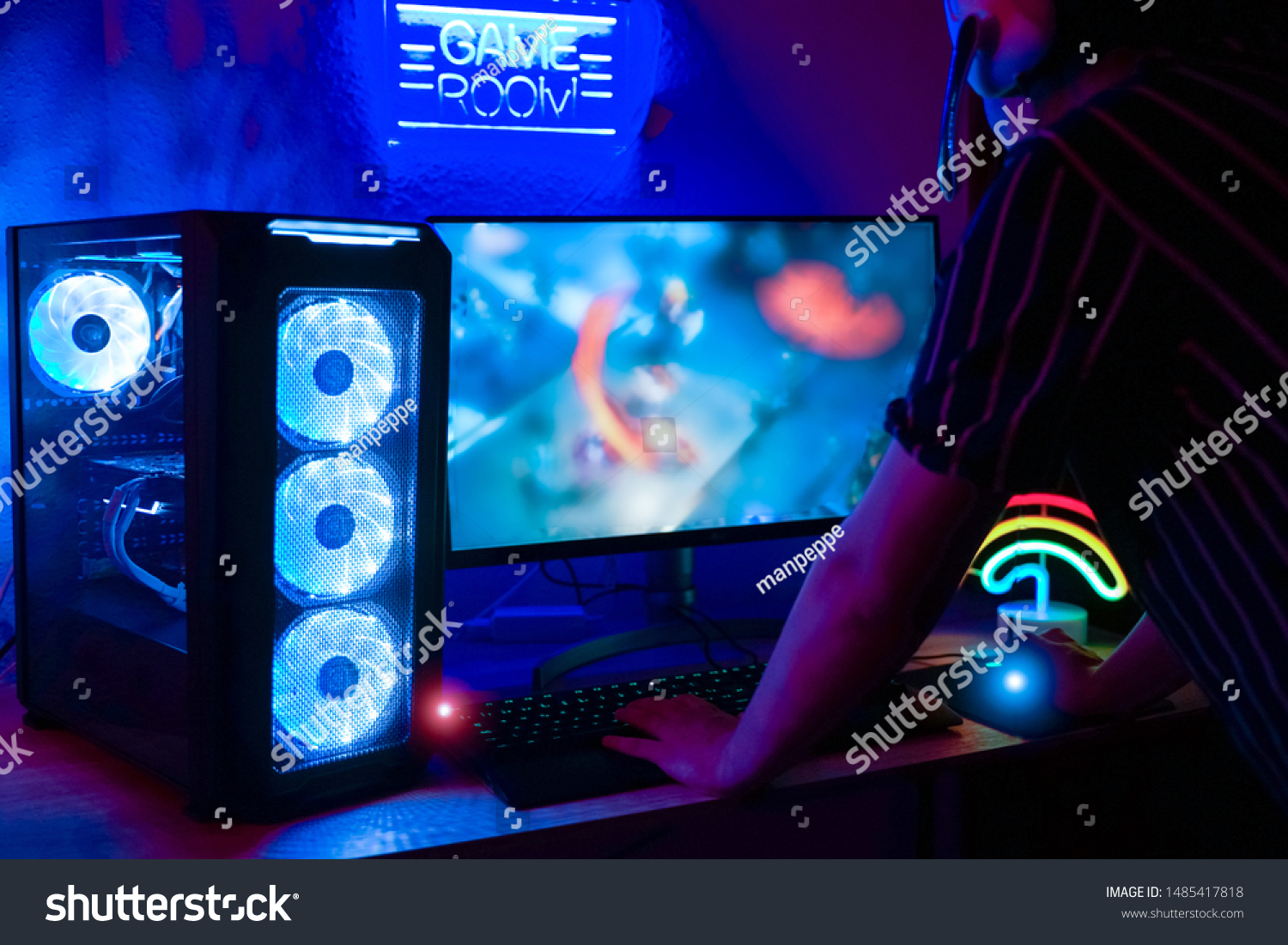 Young gamer playing online - The best game for the computer. New technology game trends and entertainment concept - Image