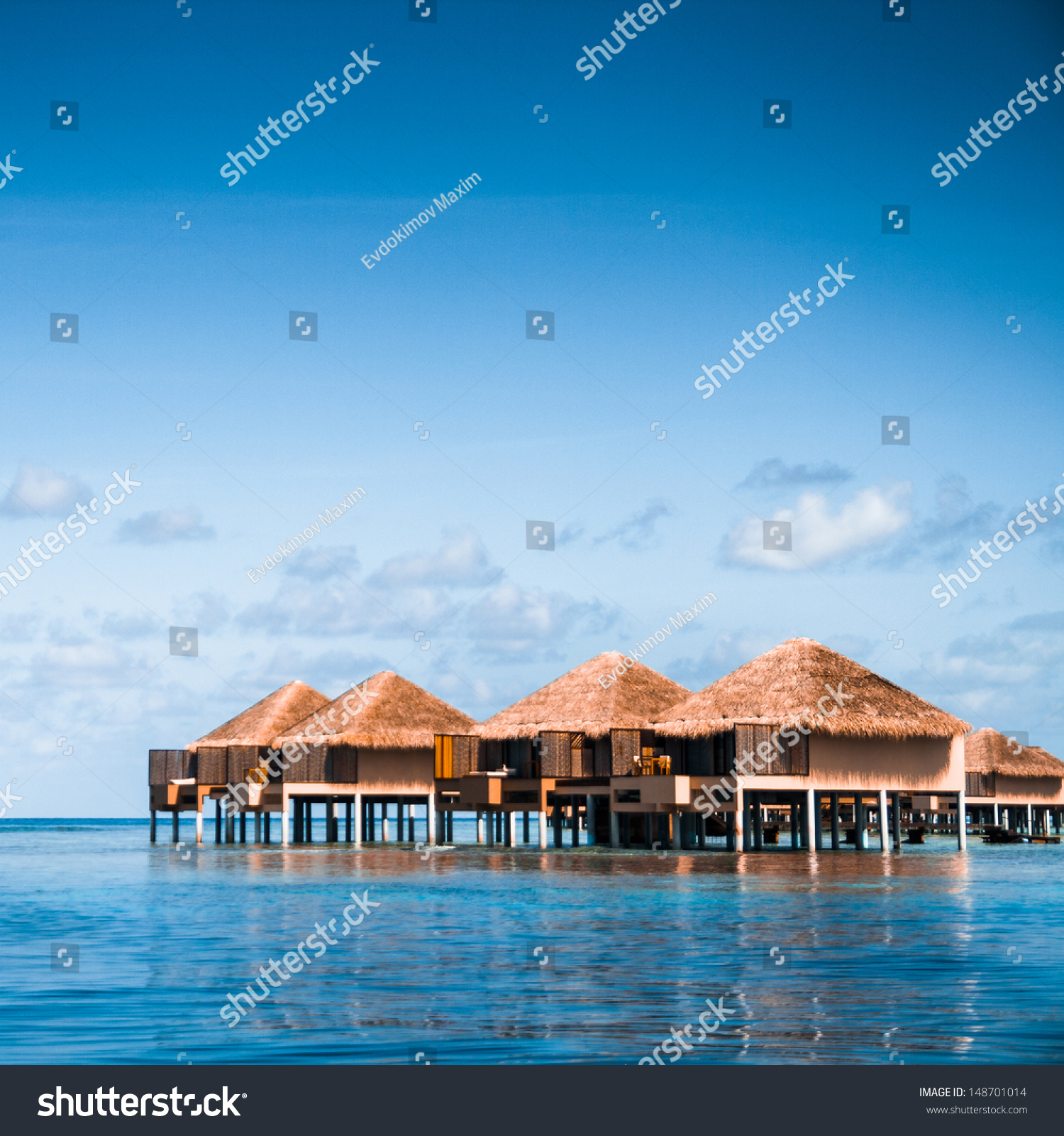 Over water bungalows with steps into amazing green lagoon