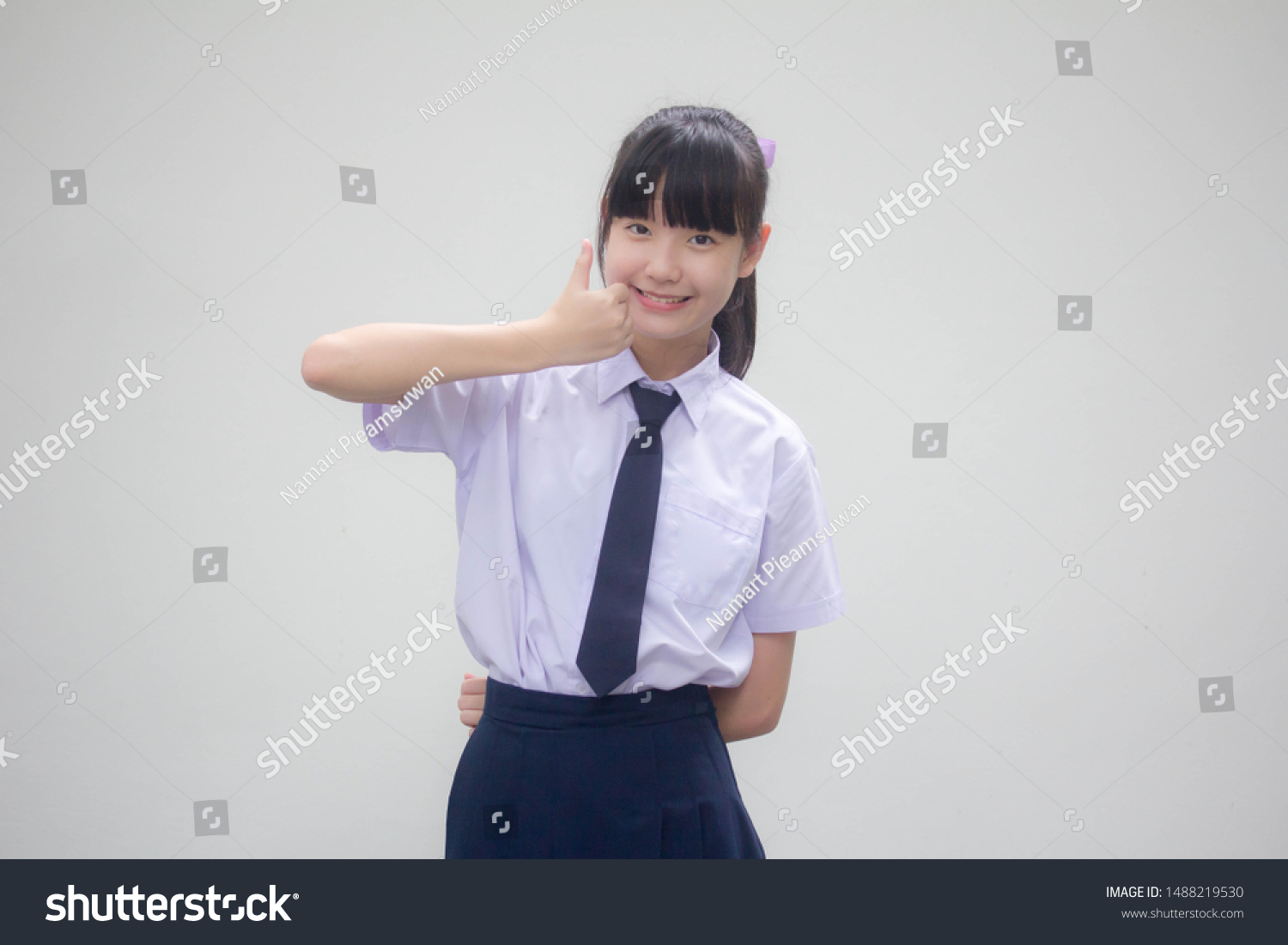 Portrait of thai Junior high school student uniform beautiful girl excellent