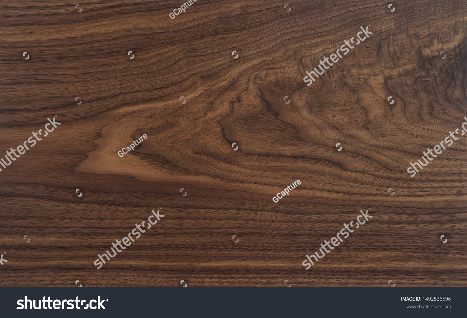 Texture of black walnut board with oil finish