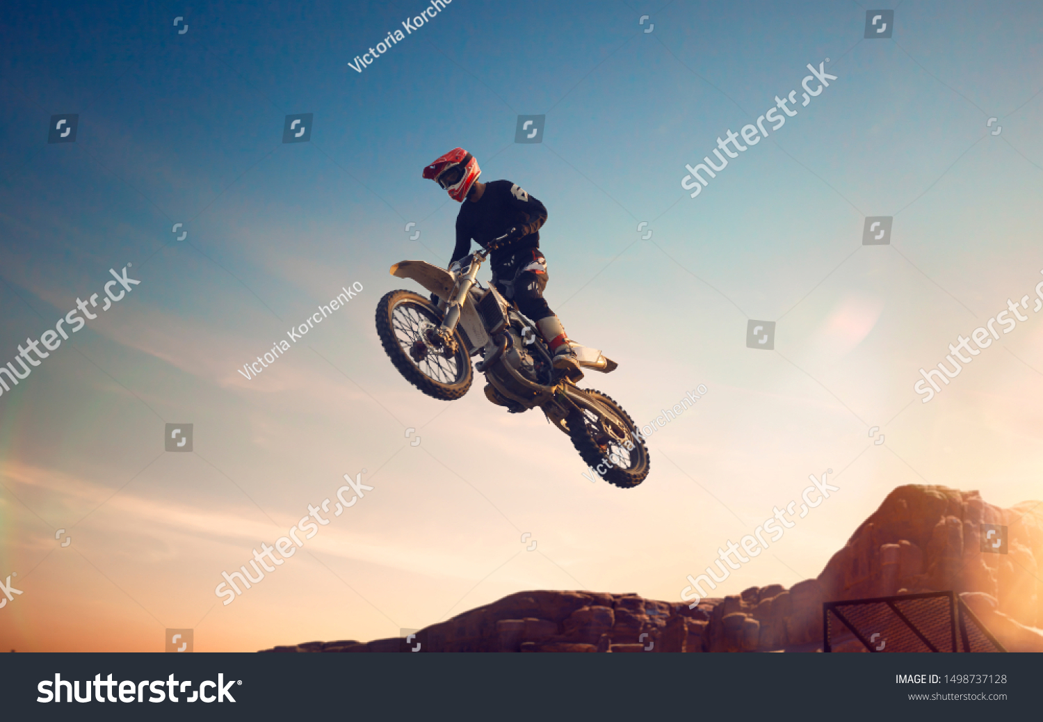 Motofreestyle during sunset. Fmx. Motocross.