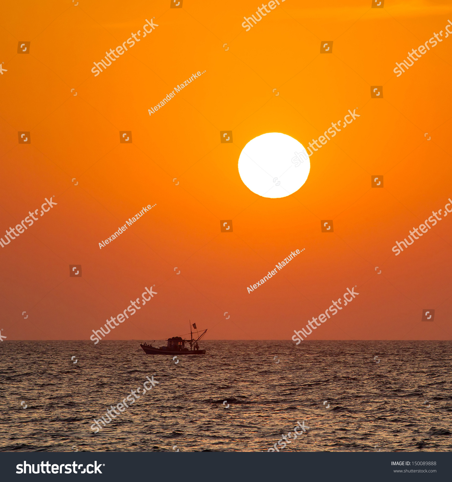 sailing boat in the sea at sunset