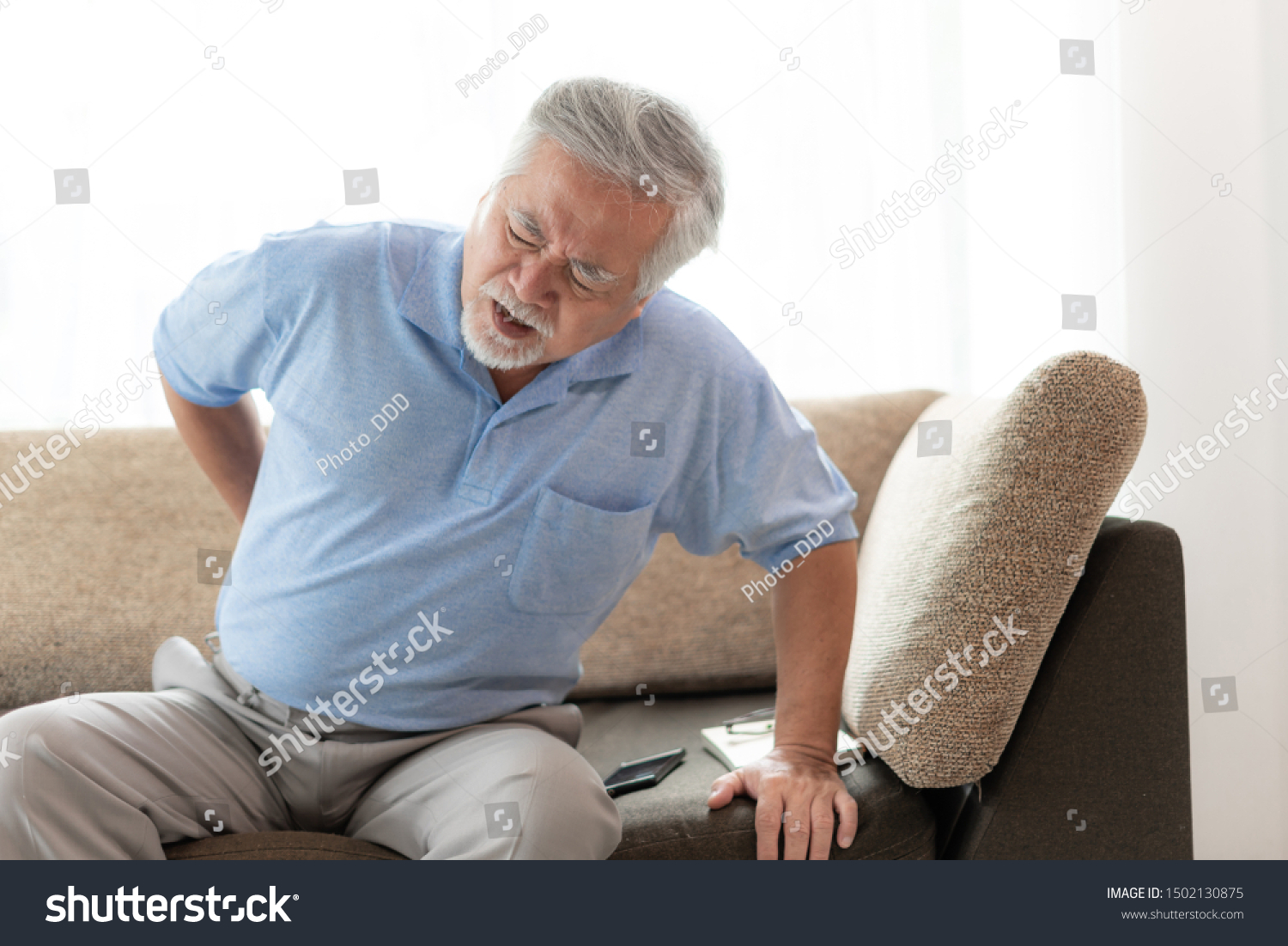 Elderly patients in bed Asian senior man patients back pain - medical and healthcare concept