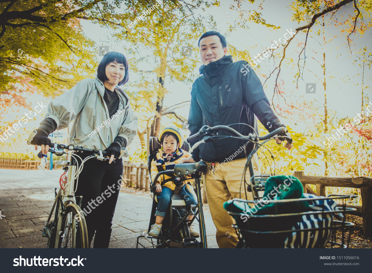 Happy and playful japanese family in a park in Tokyo