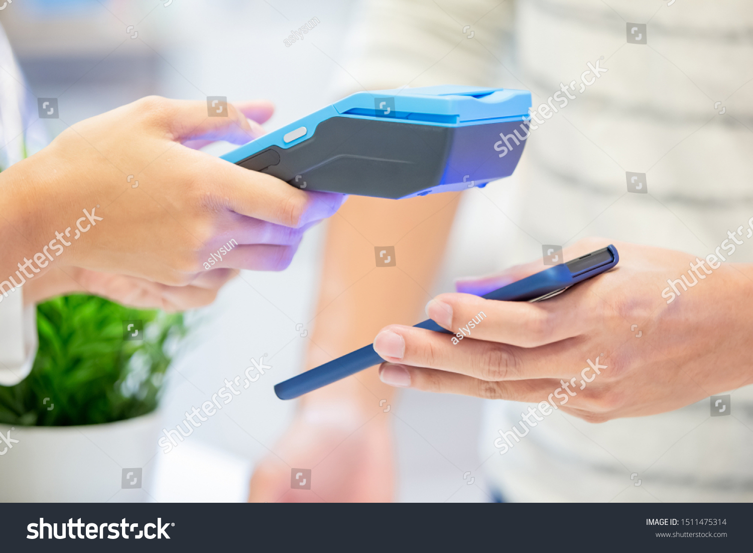 mobile payment concept - close up of pay bills by Phone to Credit Card System