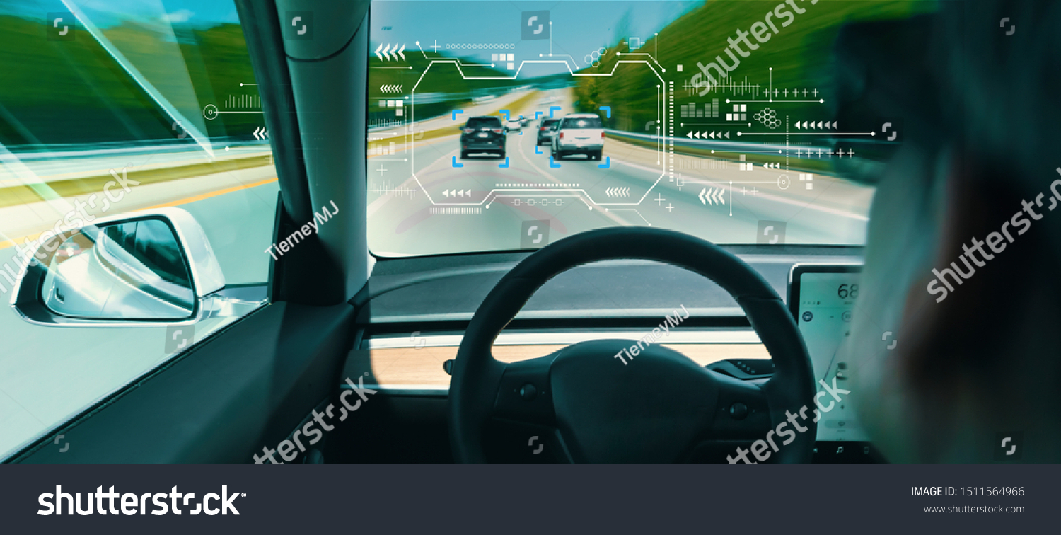 Person in a self driving autonomous car with autopilot