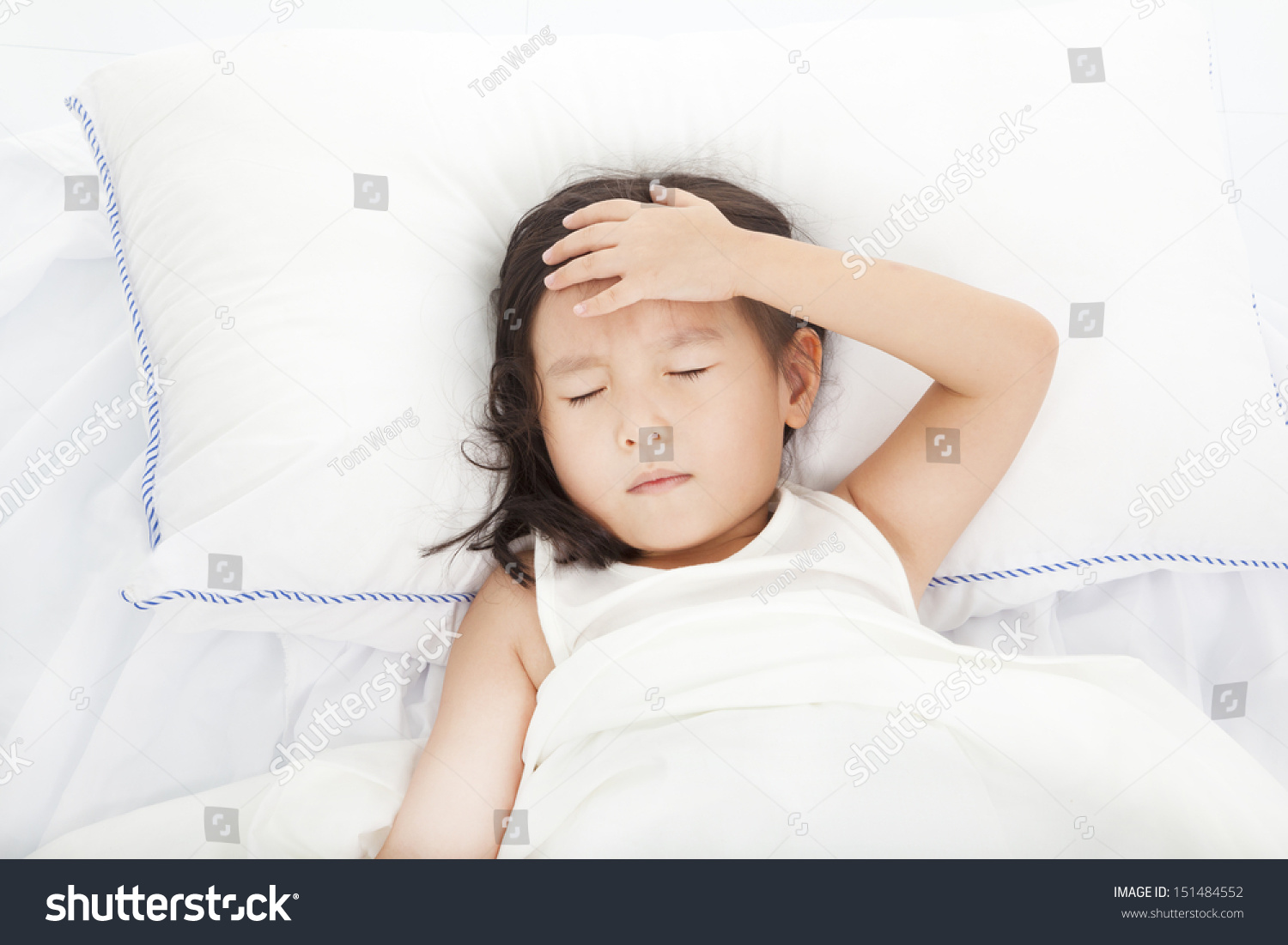Little girl with illness on the  bed 