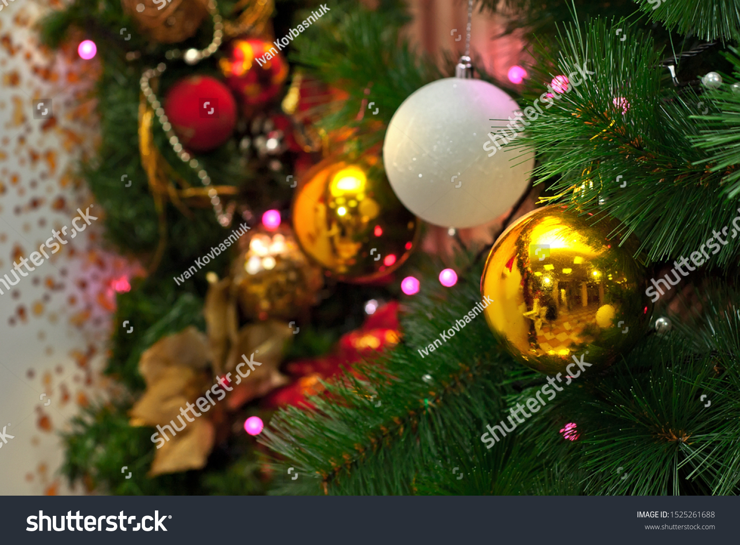 Christmas tree decorated with garlands and layers. Shiny and mirror ...