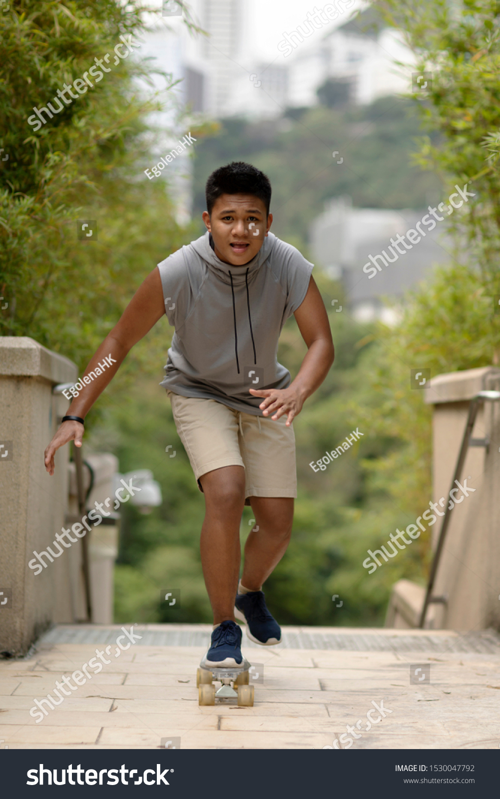 Teenager skateboarding. Young asian man skateboarding. 