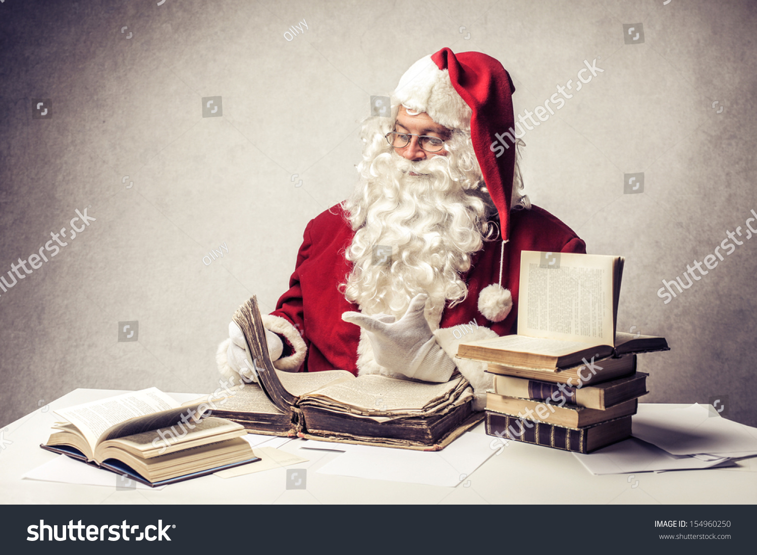 Santa Claus reads old books