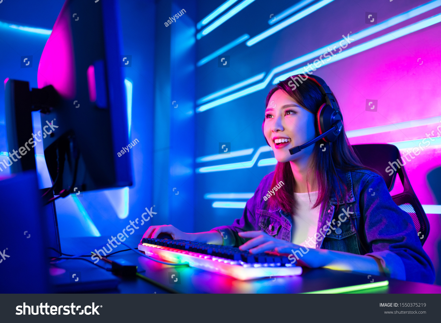 Young Asian Pretty Pro Gamer having live stream and playing in Online Video Game