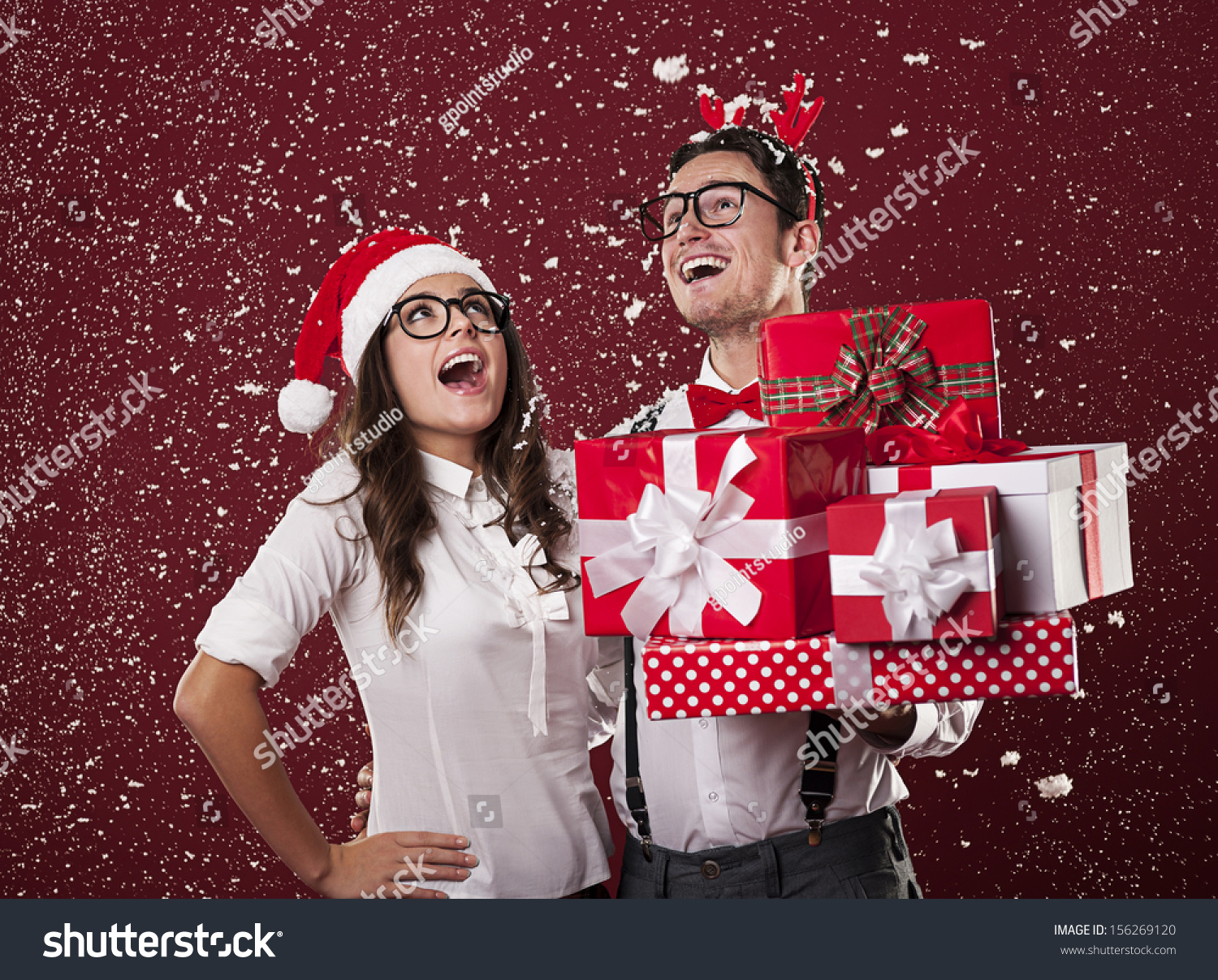 Happy nerd couple with christmas presents