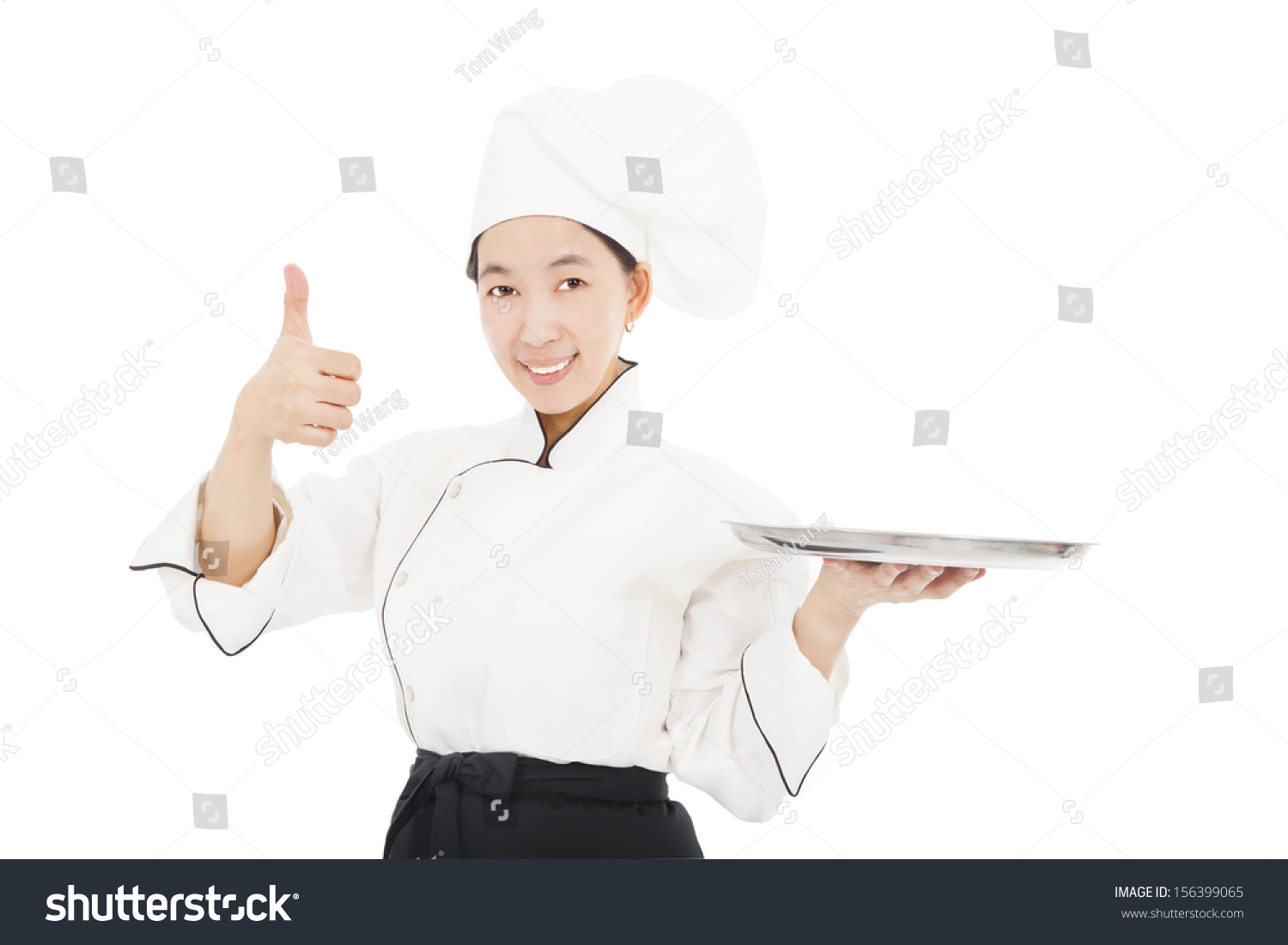 smiling young woman chef with thumb up