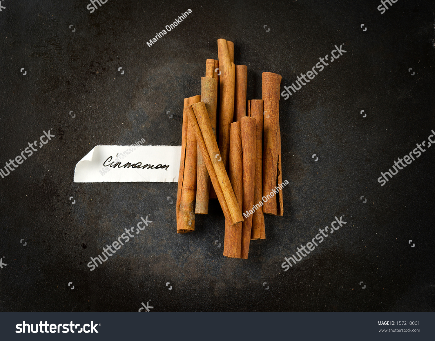 A bunch of cinnamon sticks with manually signed paper label