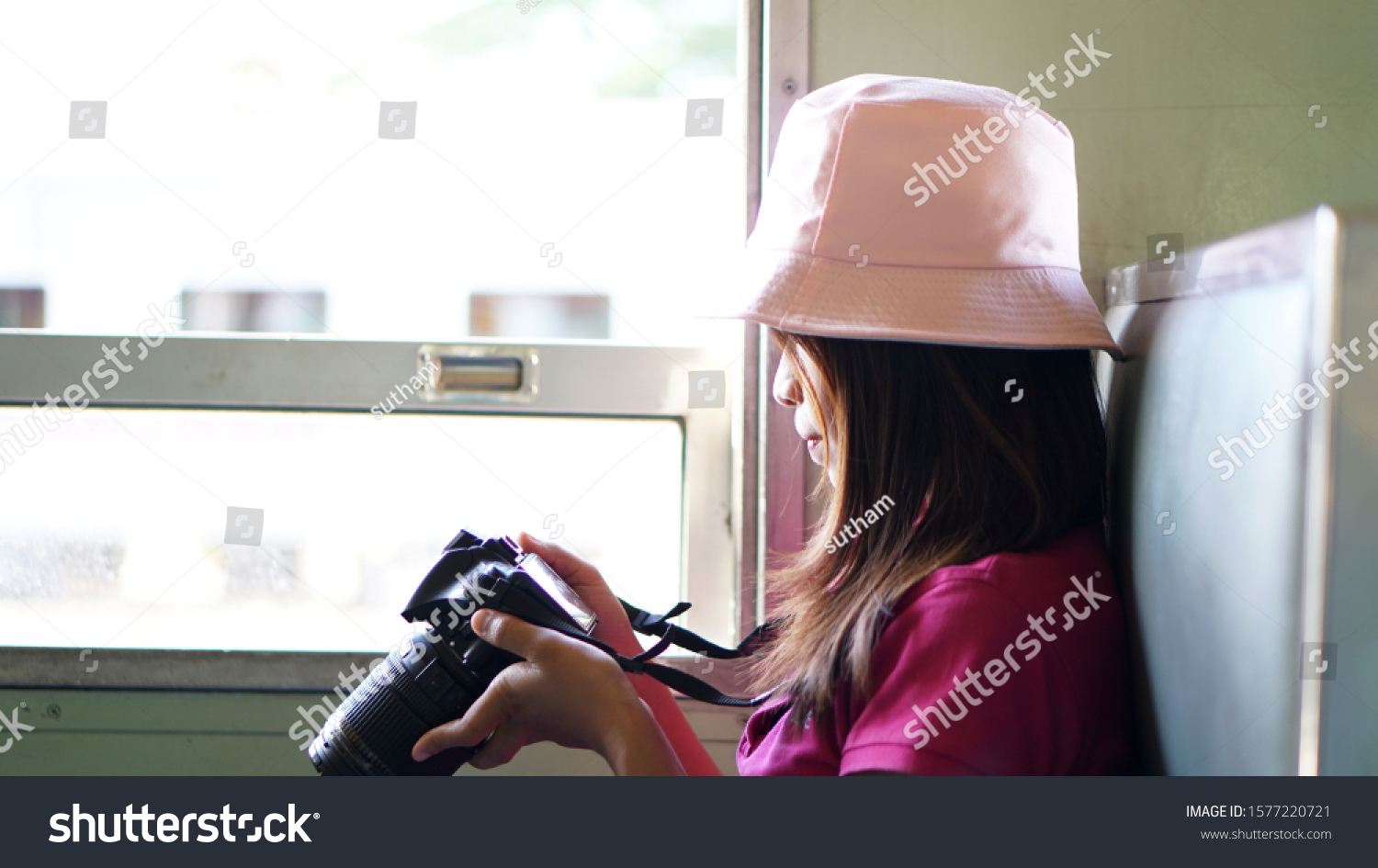 Asian woman tourists taking pictures on the train            