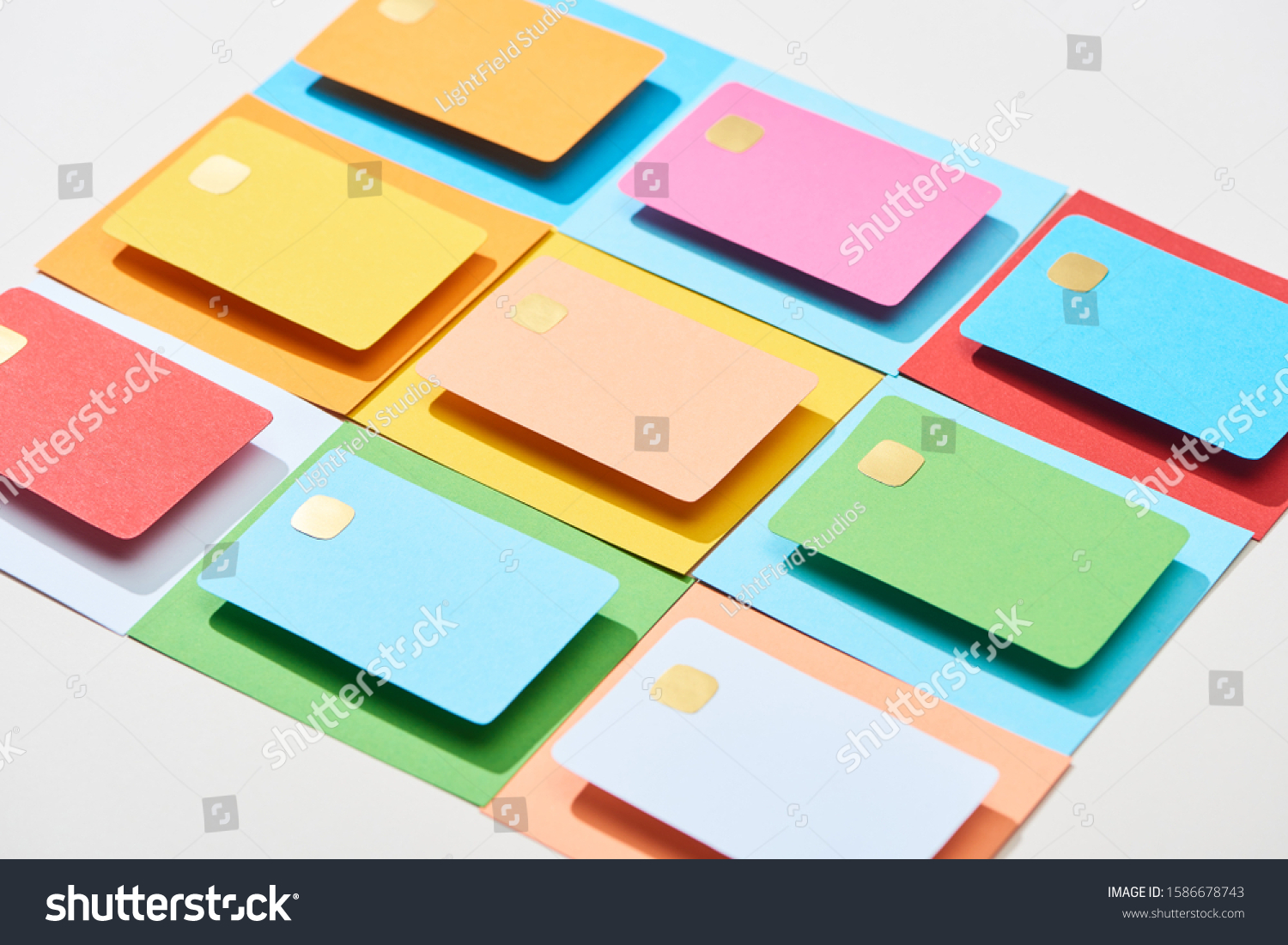 multicolored empty credit cards on grey background