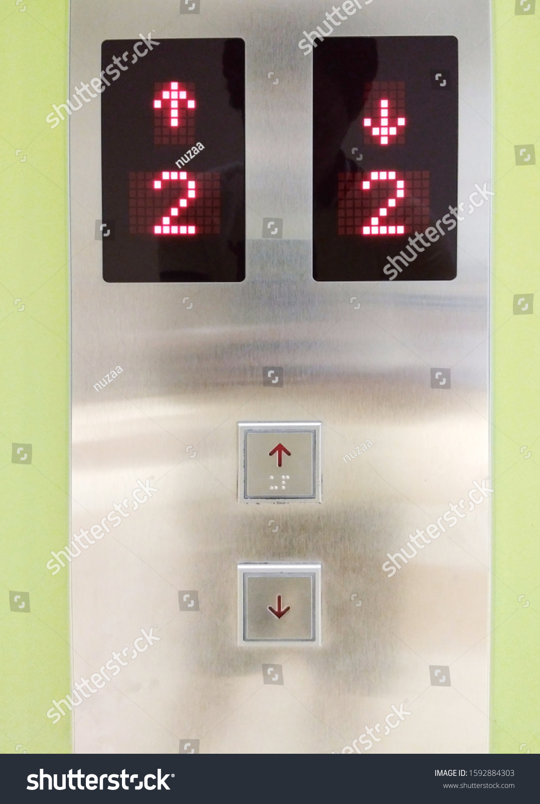Elevator button up and down in various floors Inside the building For ...