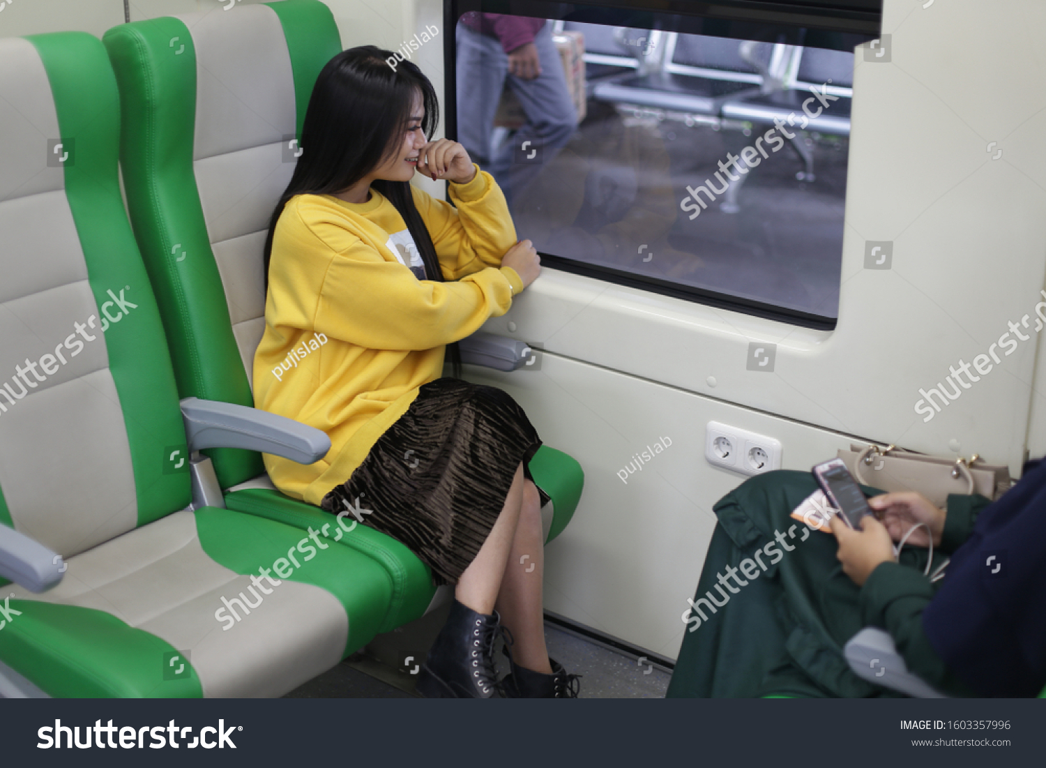 asian woman train. asian woman sitting in subway