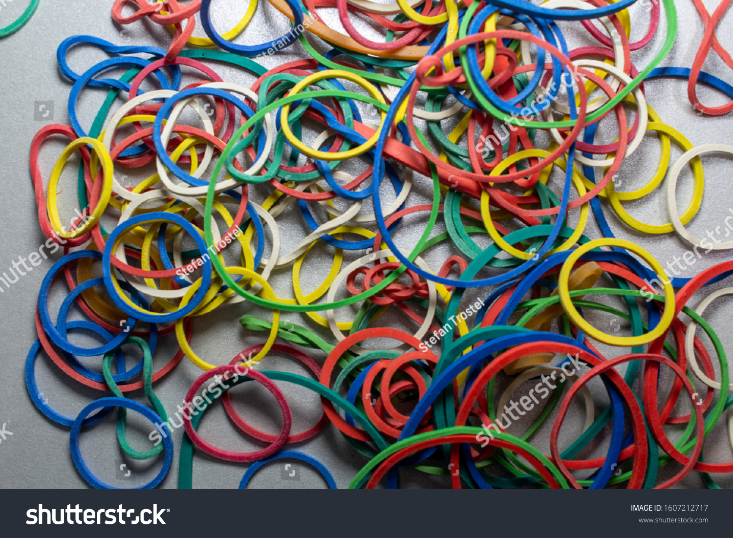 colored rubber bands on a table