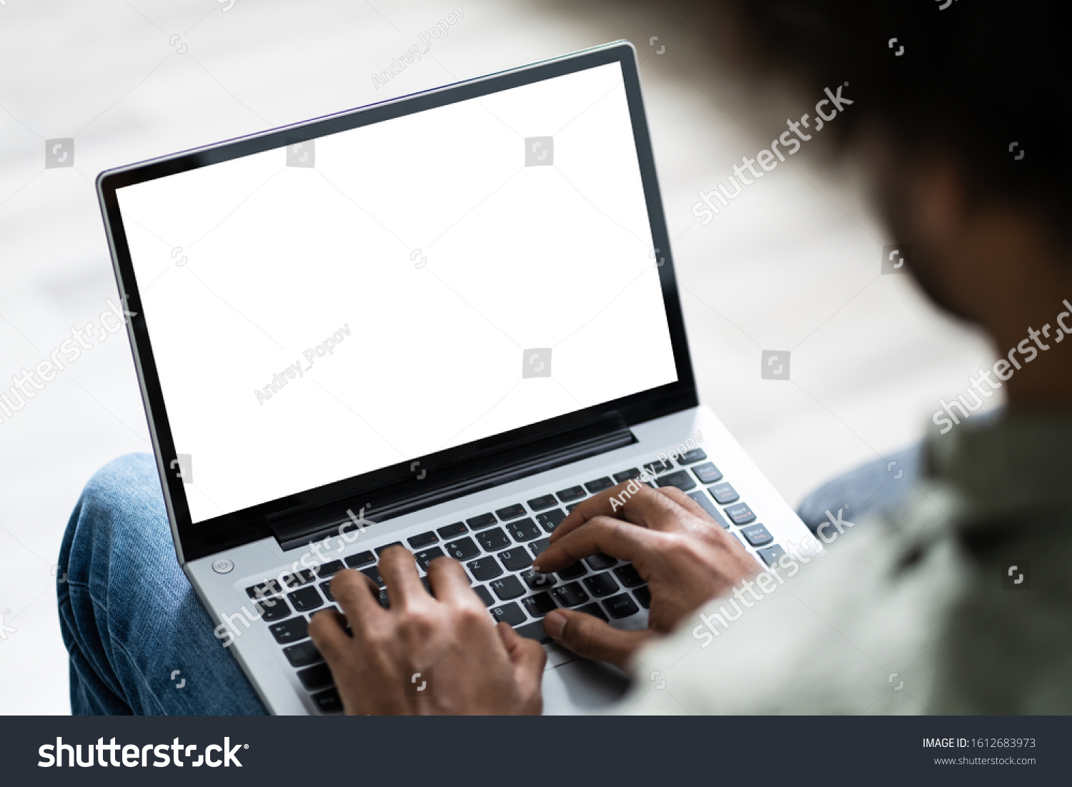 Close-up Of Young Man Working On Laptop At Home