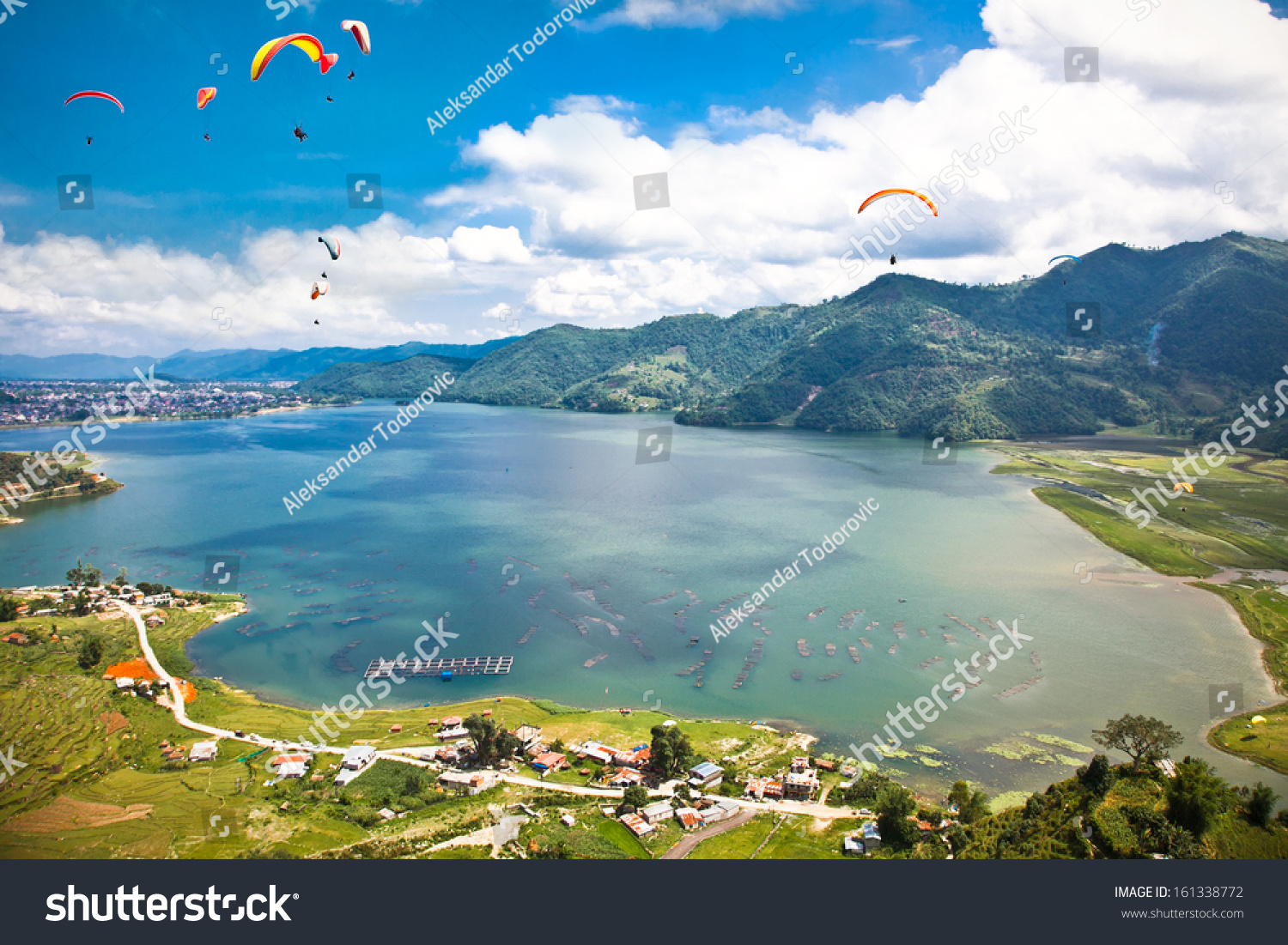 Paraglider flying over the  Fewa (Phewa) lake in Pokhara  Nepal. 