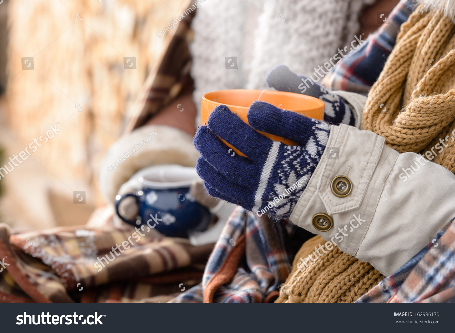 Winter hot tea hands holding steaming mug countryside cottage