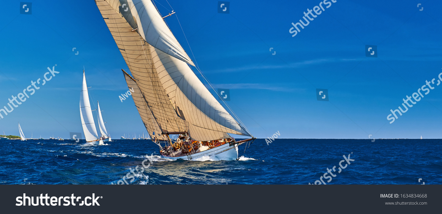 Sailing yachts race in strong wind