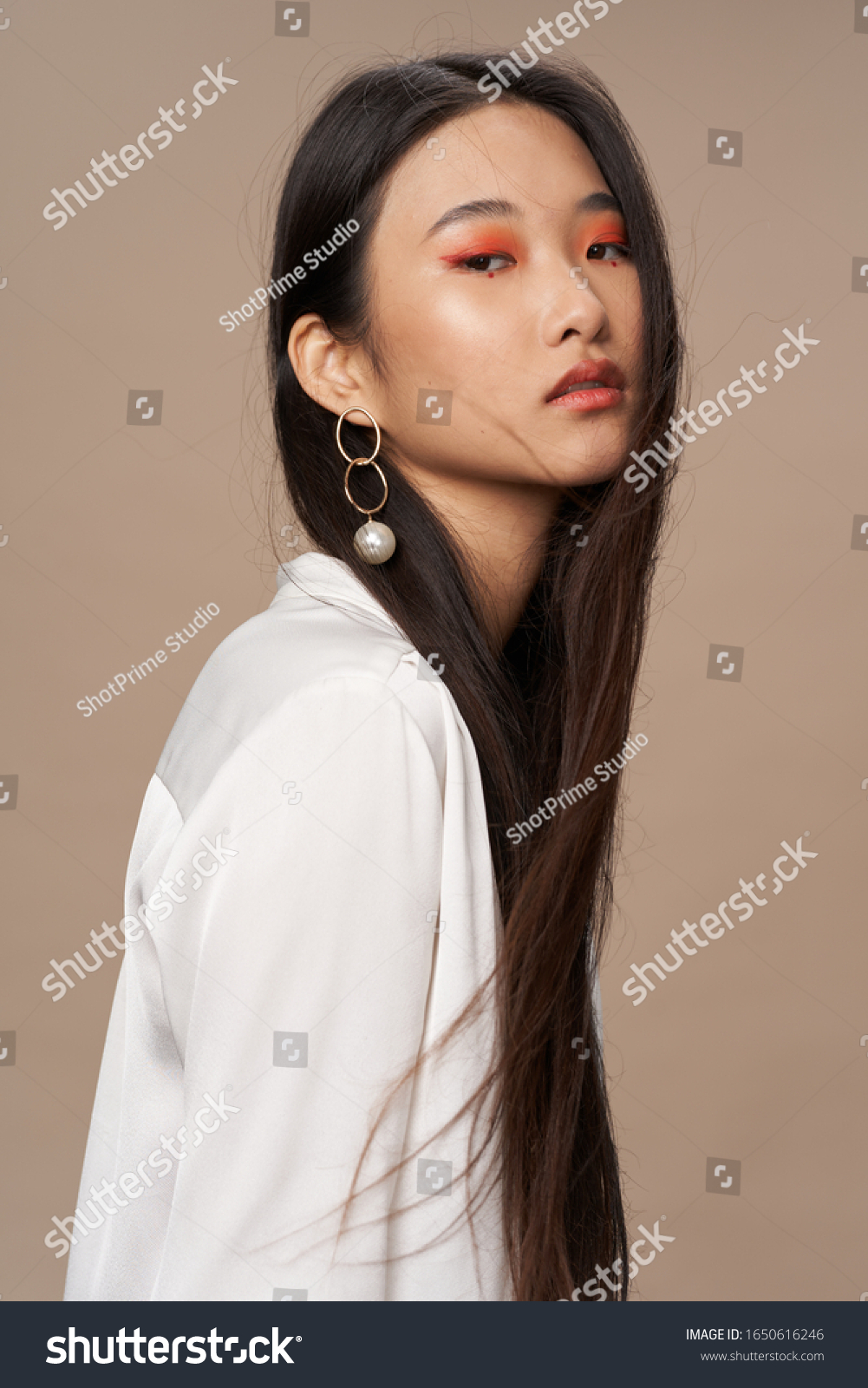 Beautiful woman dark hair catkins makeup shirt