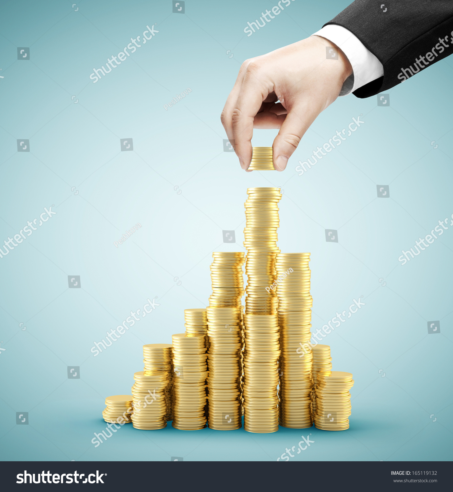 hand holding coins and build coin chart