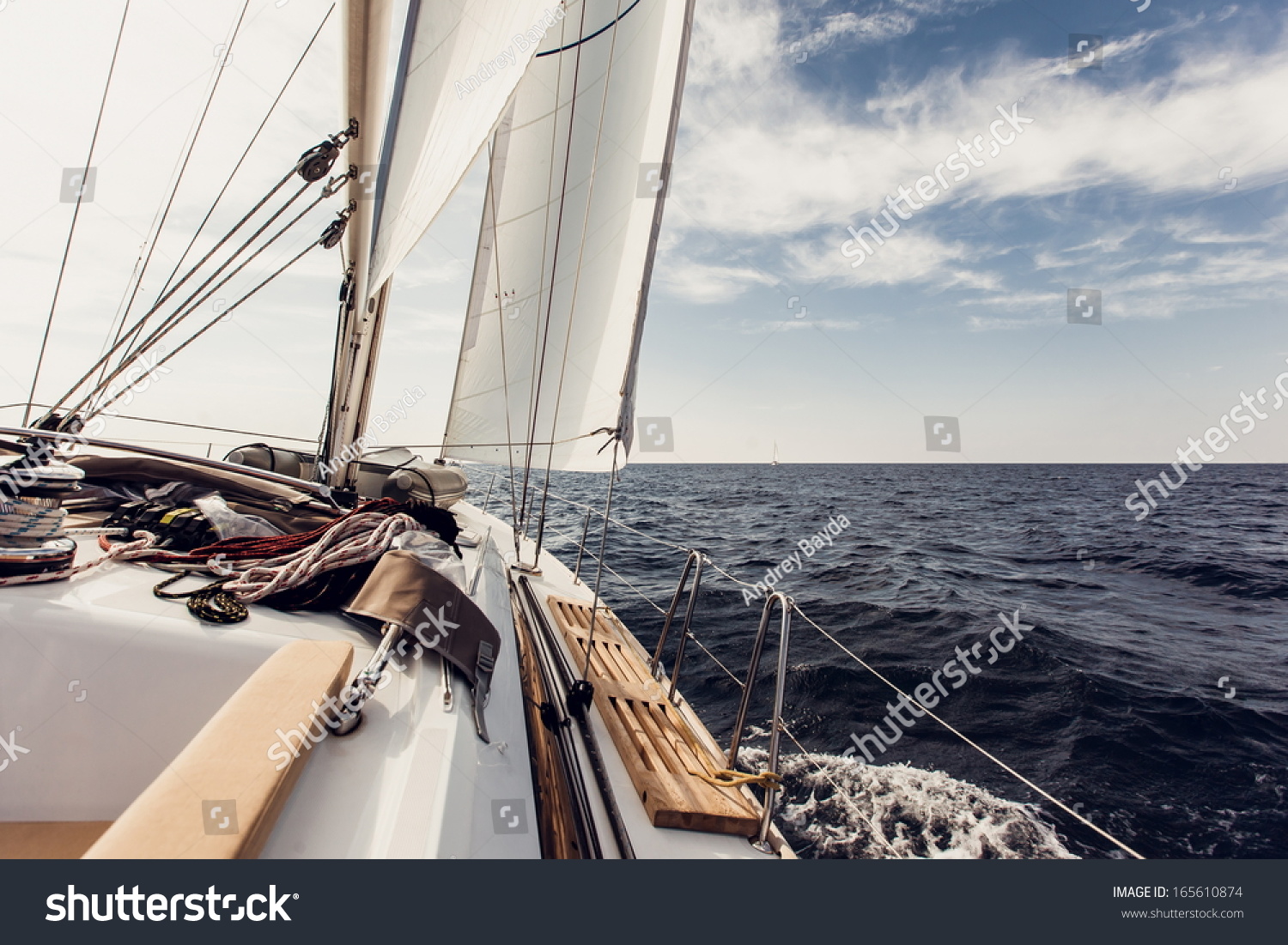 Sailing ship yachts with white sails in the open sea