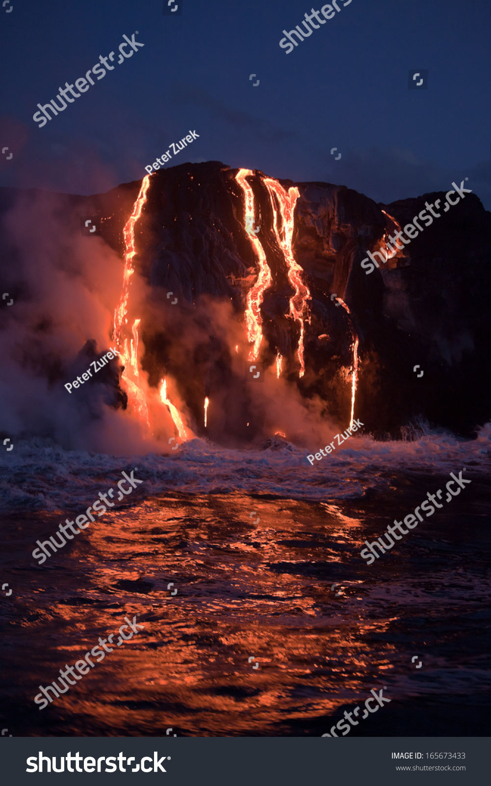 Hot lava stream is flowing into the ocean. Hawaii  Big Island.