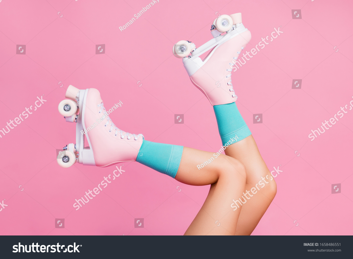 Cropped close-up profile side view of nice attractive lovely perfect feminine long legs wearing blue socks skates skating walking in air isolated over pink pastel color background