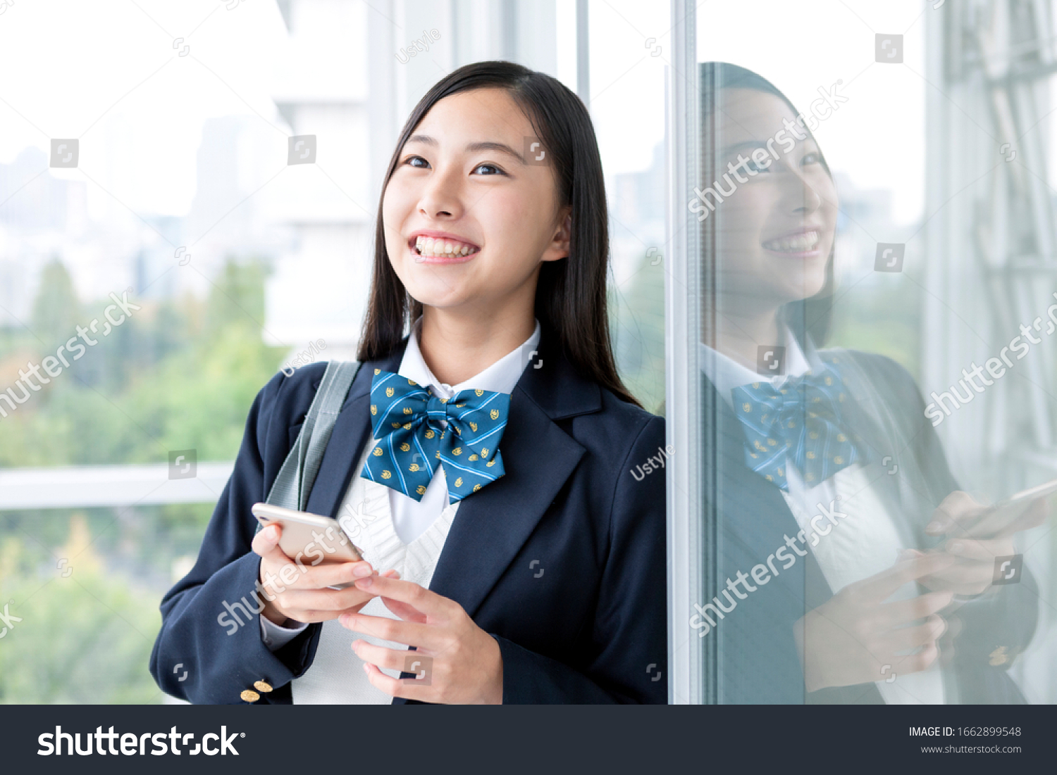 Female student operating a smartphone