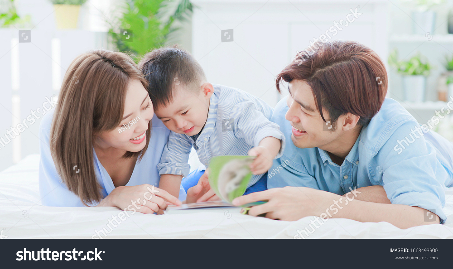 Parent read book with child happily at home