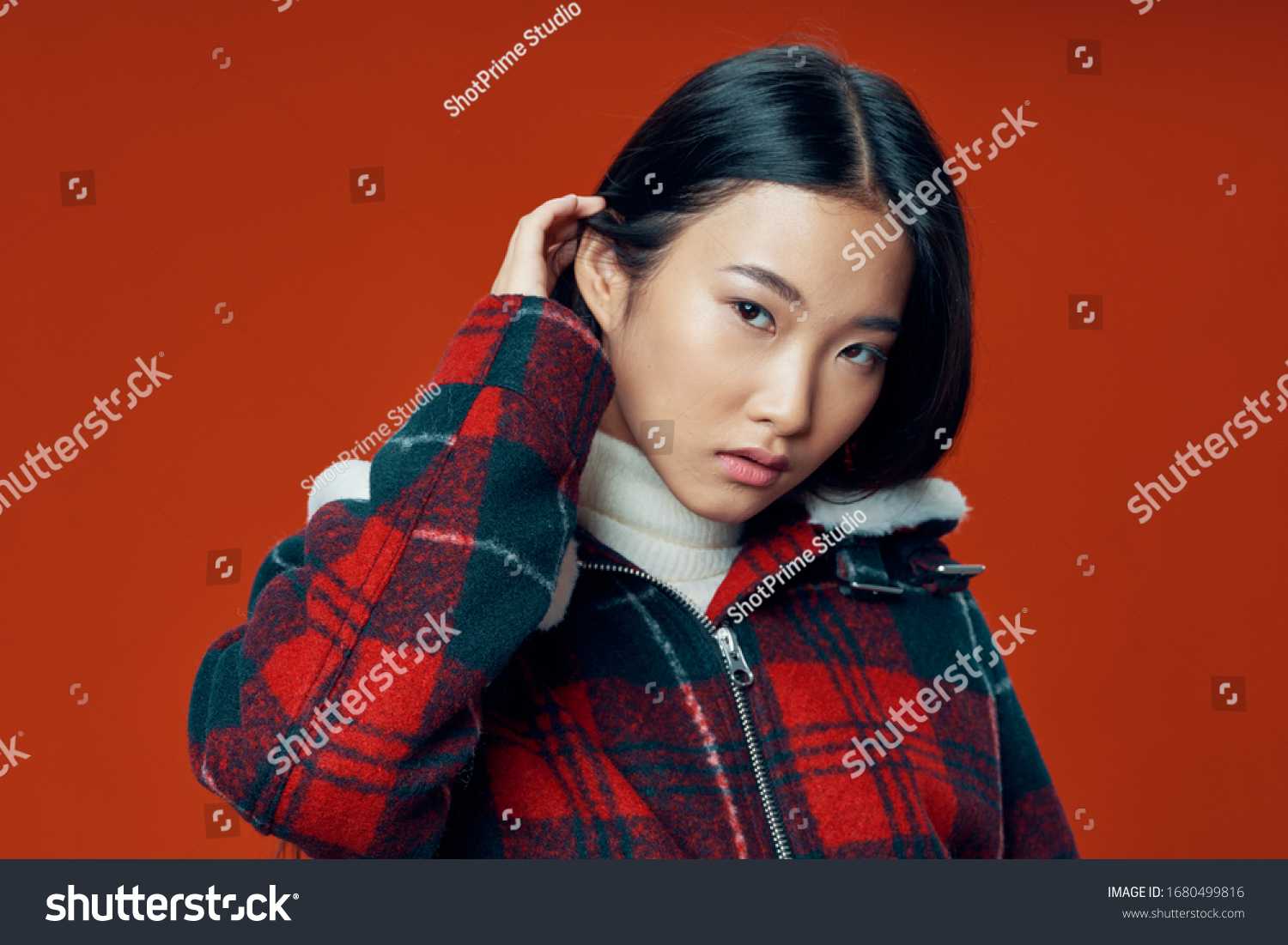 Cheerful pretty woman asian appearance checkered jacket lifestyle winter