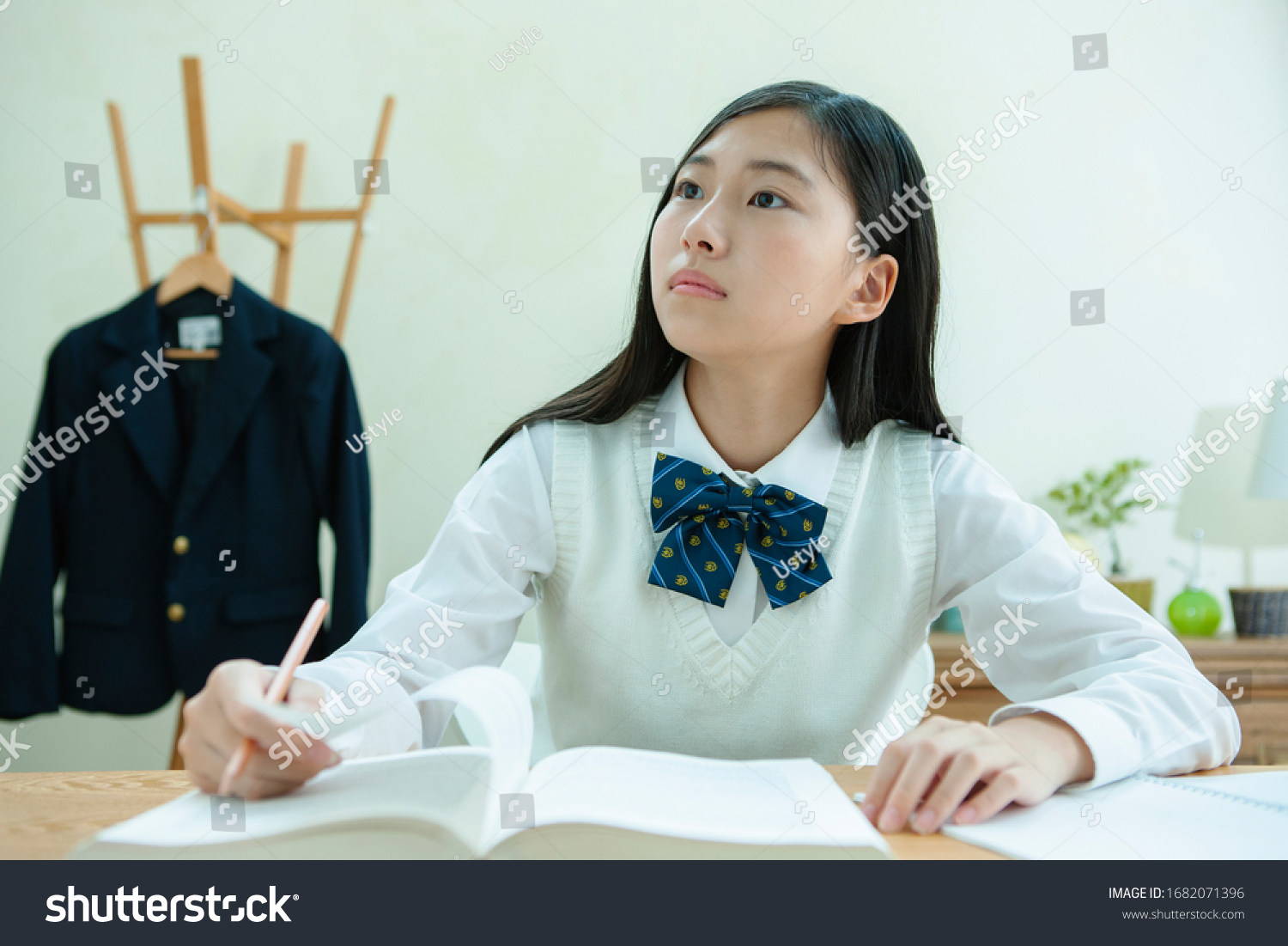 A female student wearing a uniform to study