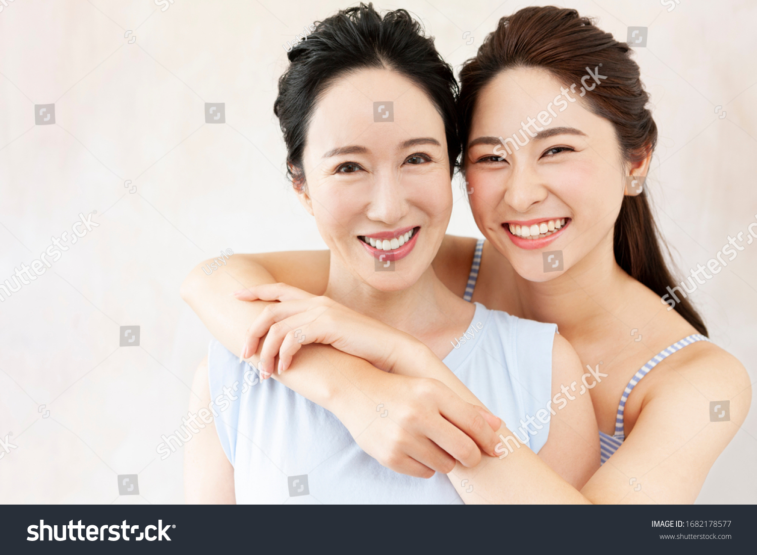 Portrait of smiling mother and daughter