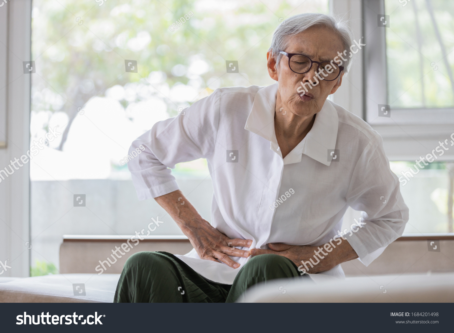 Sick senior patient with belly pain severe stomach ache symptoms gastrointestinal system disease gut digestion problems diarrhoea elderly woman suffer from stomachache irritable bowel food poisoning