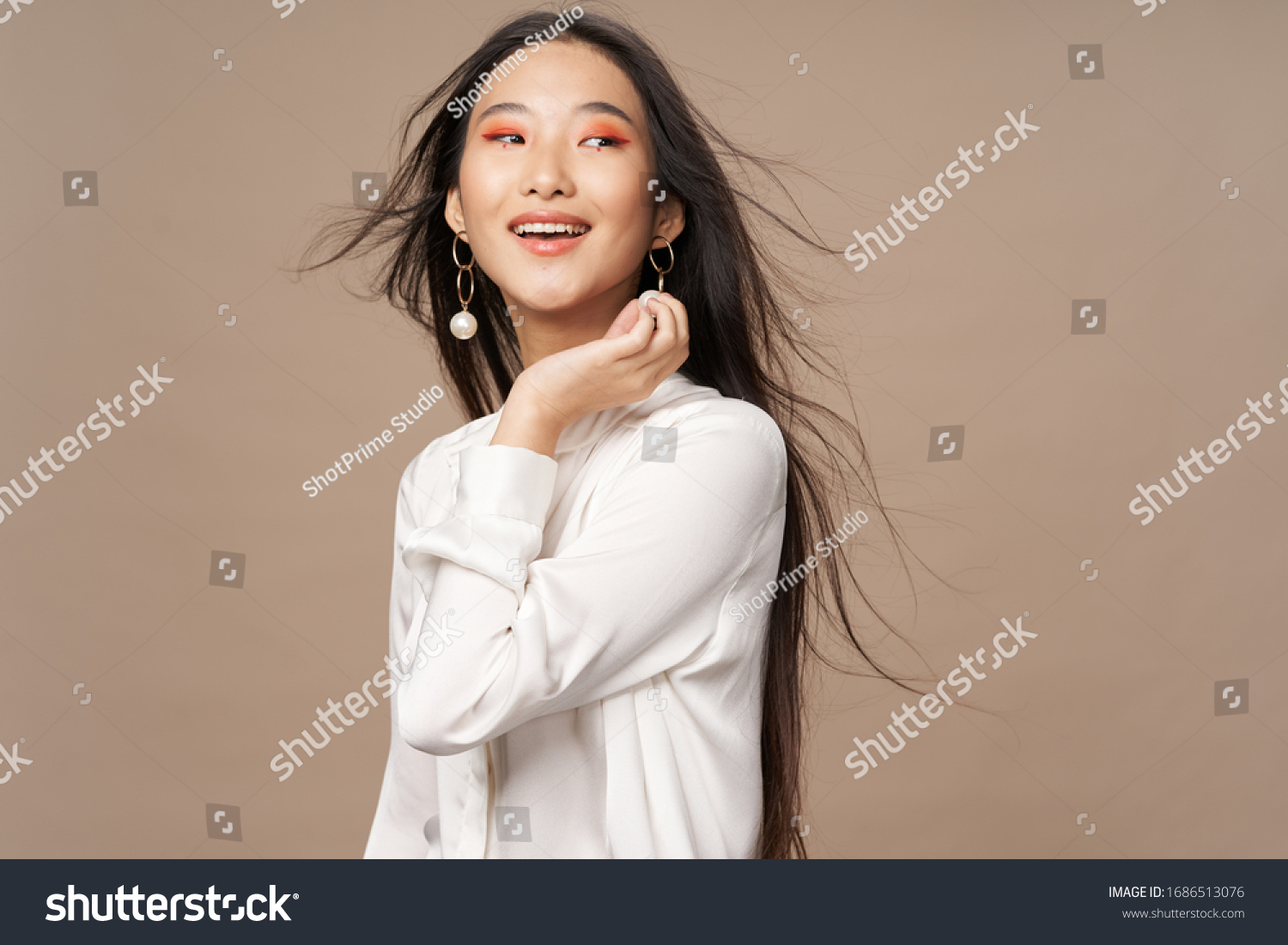 Beautiful woman Asian appearance bright makeup luxury smile model beige background