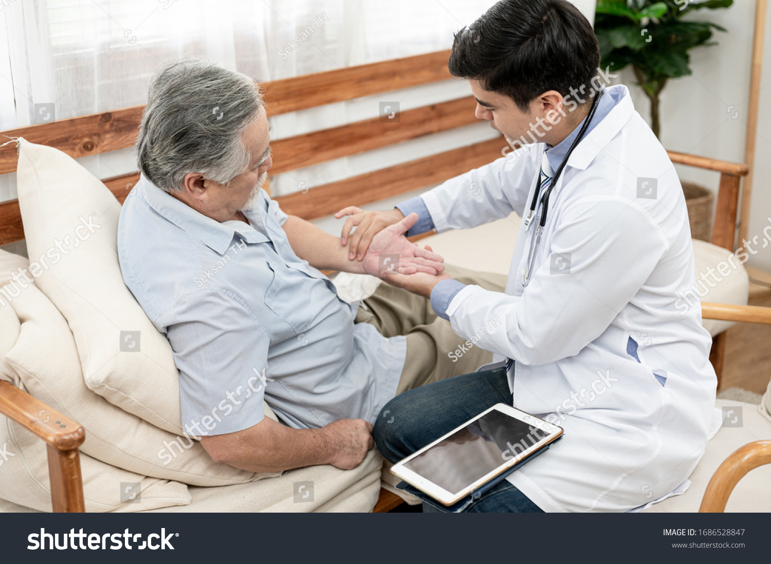 Asian elderly man are sick doctor to check their symptoms at home. Health care life style pharmacy medical elder insurance after retire concept.