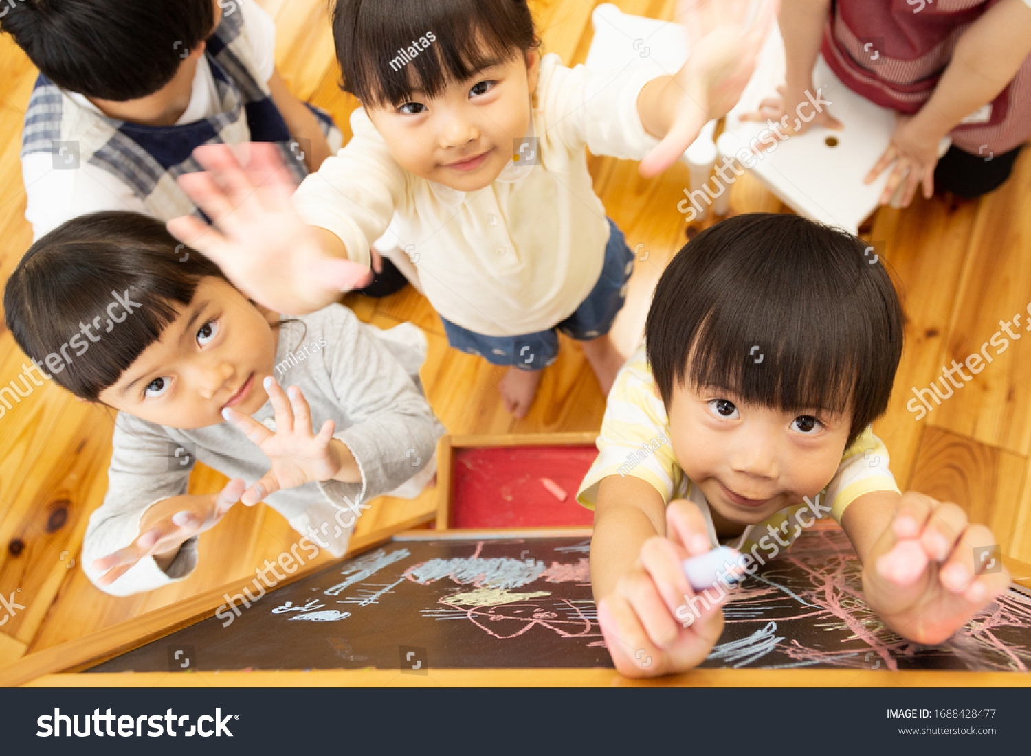Children drawing on the blackboard