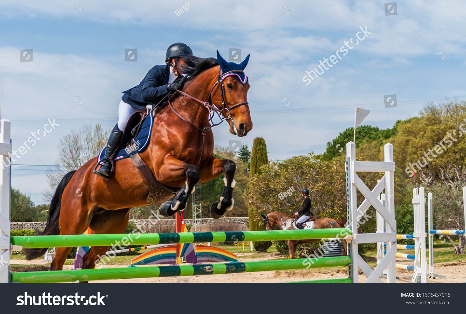 Show jumping competition on horseback.